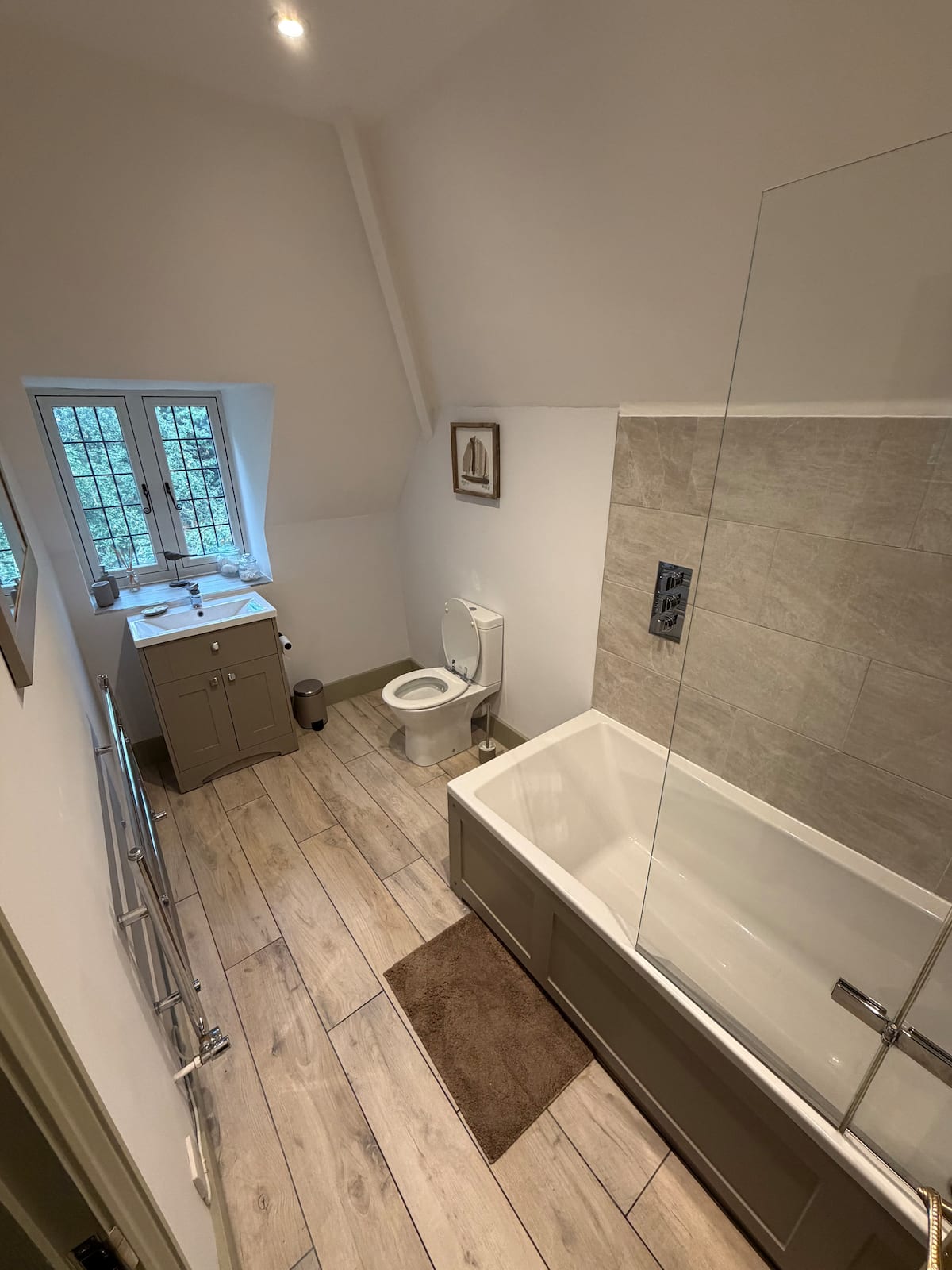 The family bathroom, with a bath under the slope of the roof