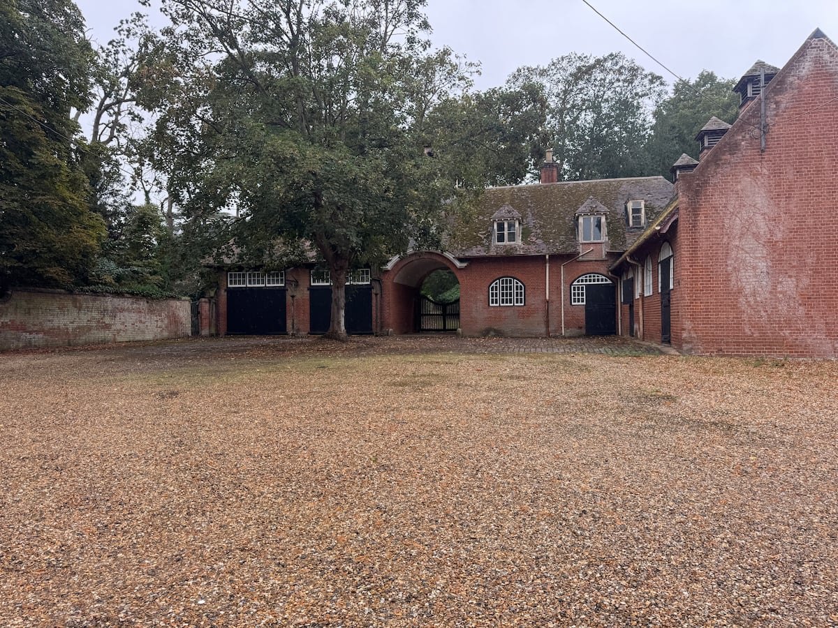 The gravel courtyard and the old brick stable range